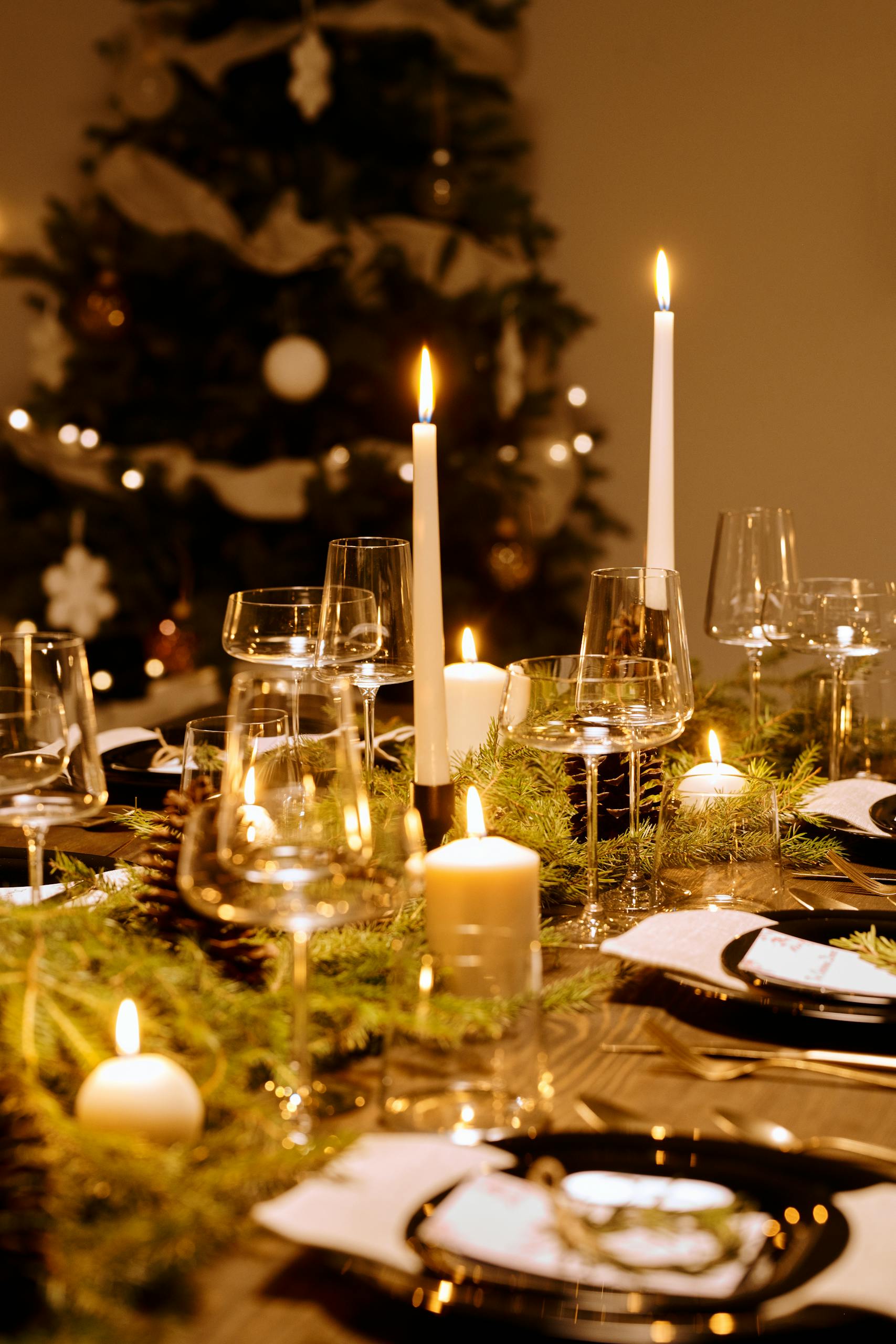 Festive Christmas dinner table adorned with candles