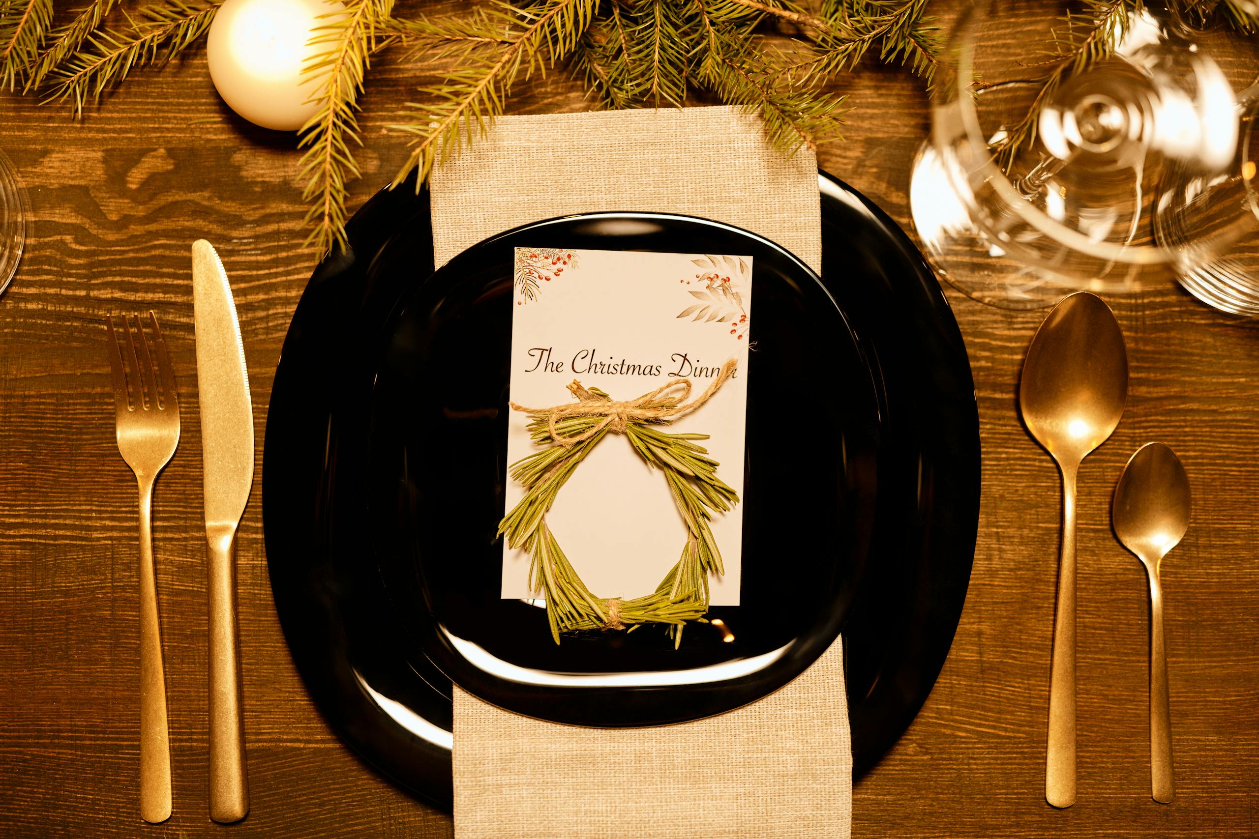 A cozy and elegant Christmas dinner table setup with festive decorations.