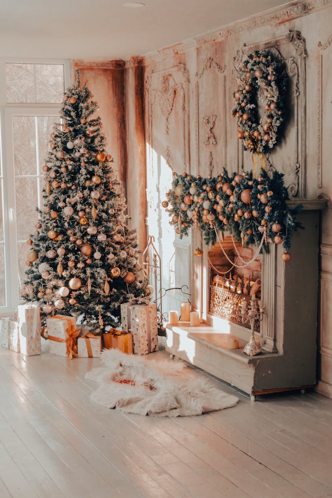 A luxurious living room with a decorated Christmas tree and festive fireplace.