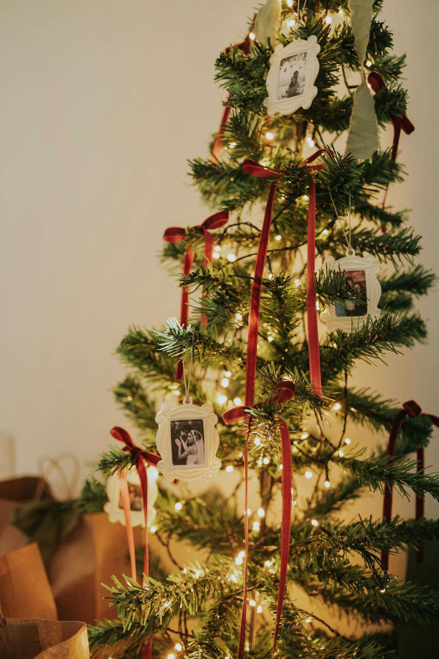 Elegant Christmas tree adorned with ornaments and lights, creating a festive and cozy atmosphere.