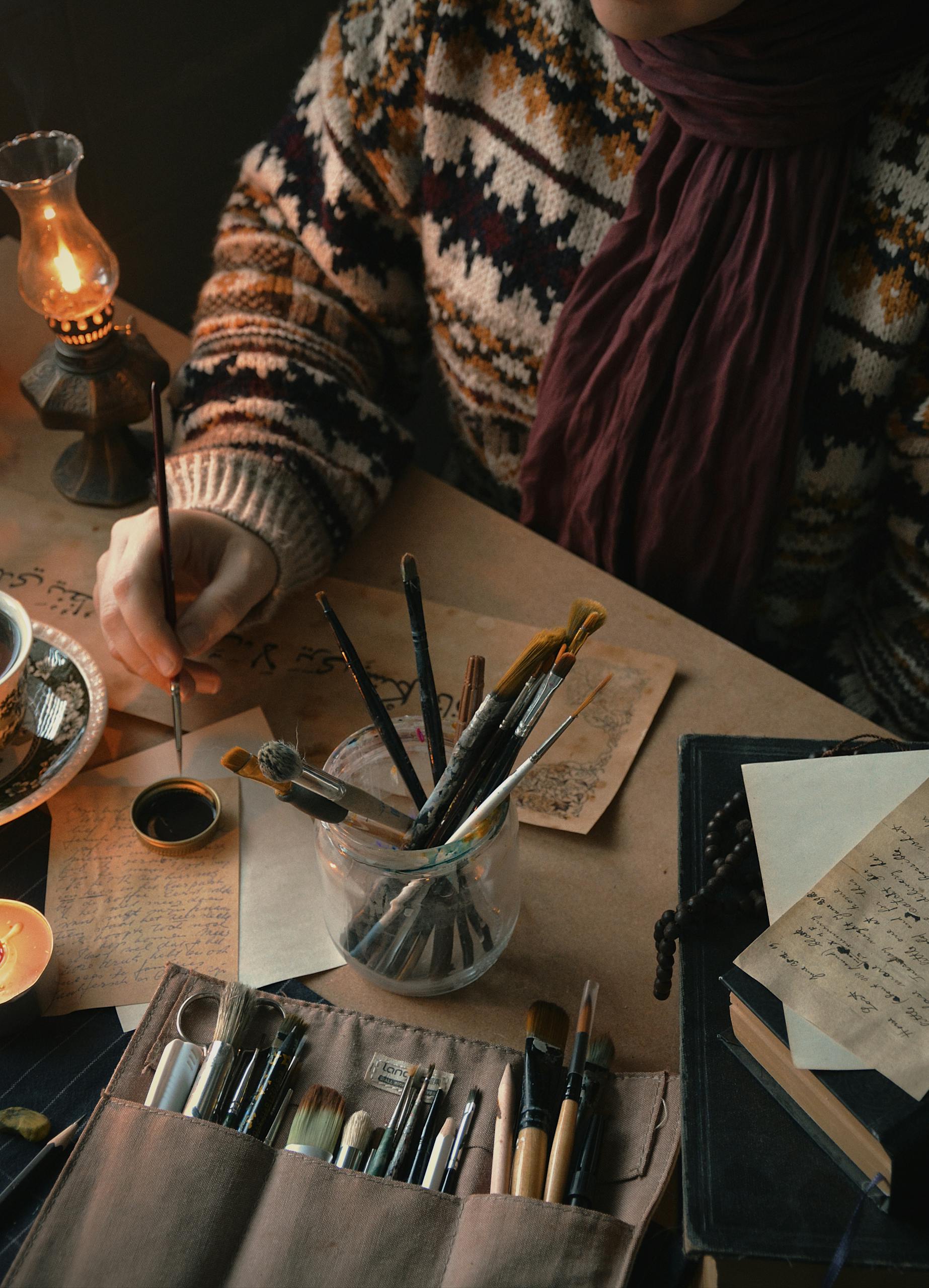 Warm cozy setting with art supplies, showcasing creativity and inspiration.