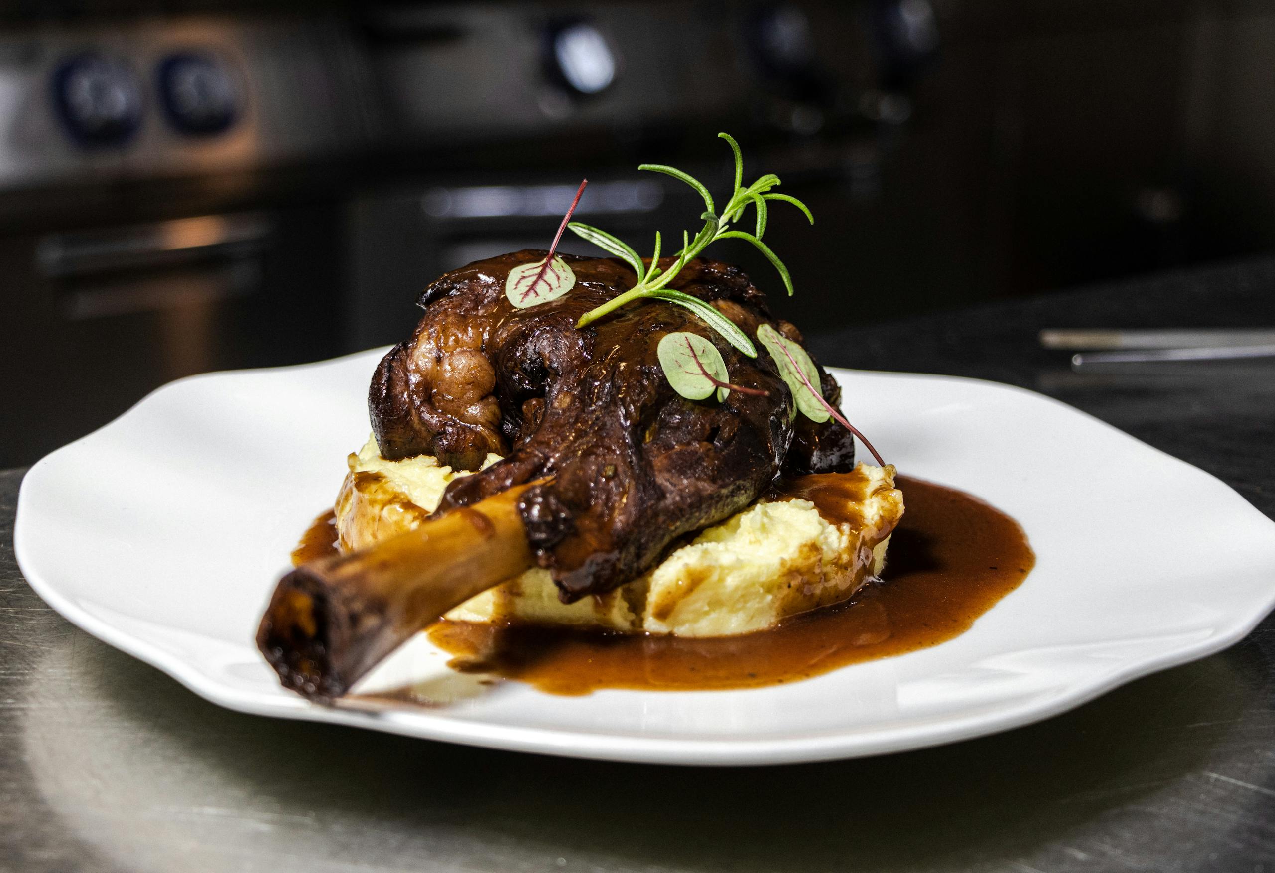 Delicious roasted lamb shanks served on creamy mashed potatoes with rich gravy.