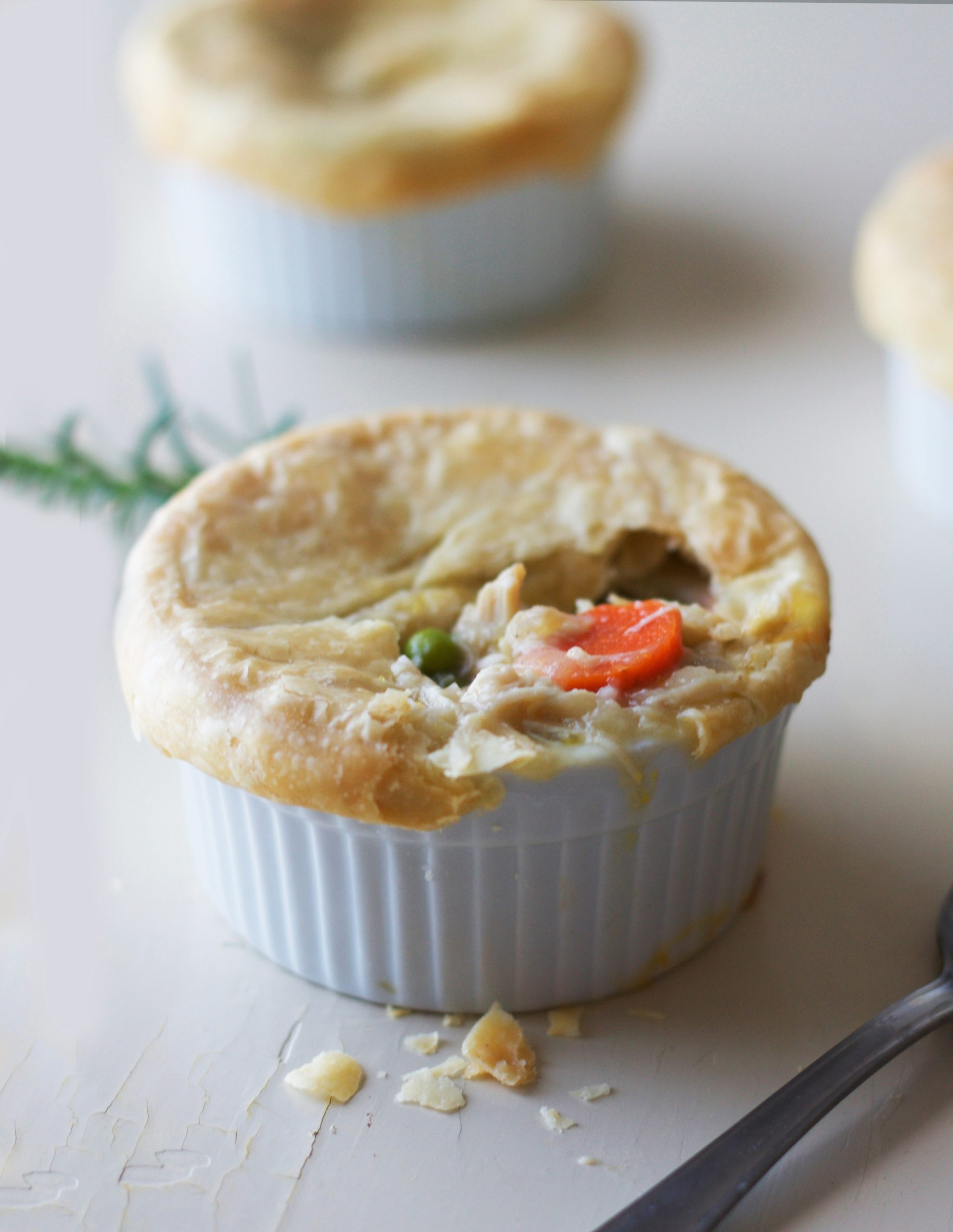 Homemade chicken and leek pie countryside comfort food with golden pastry in a white pot