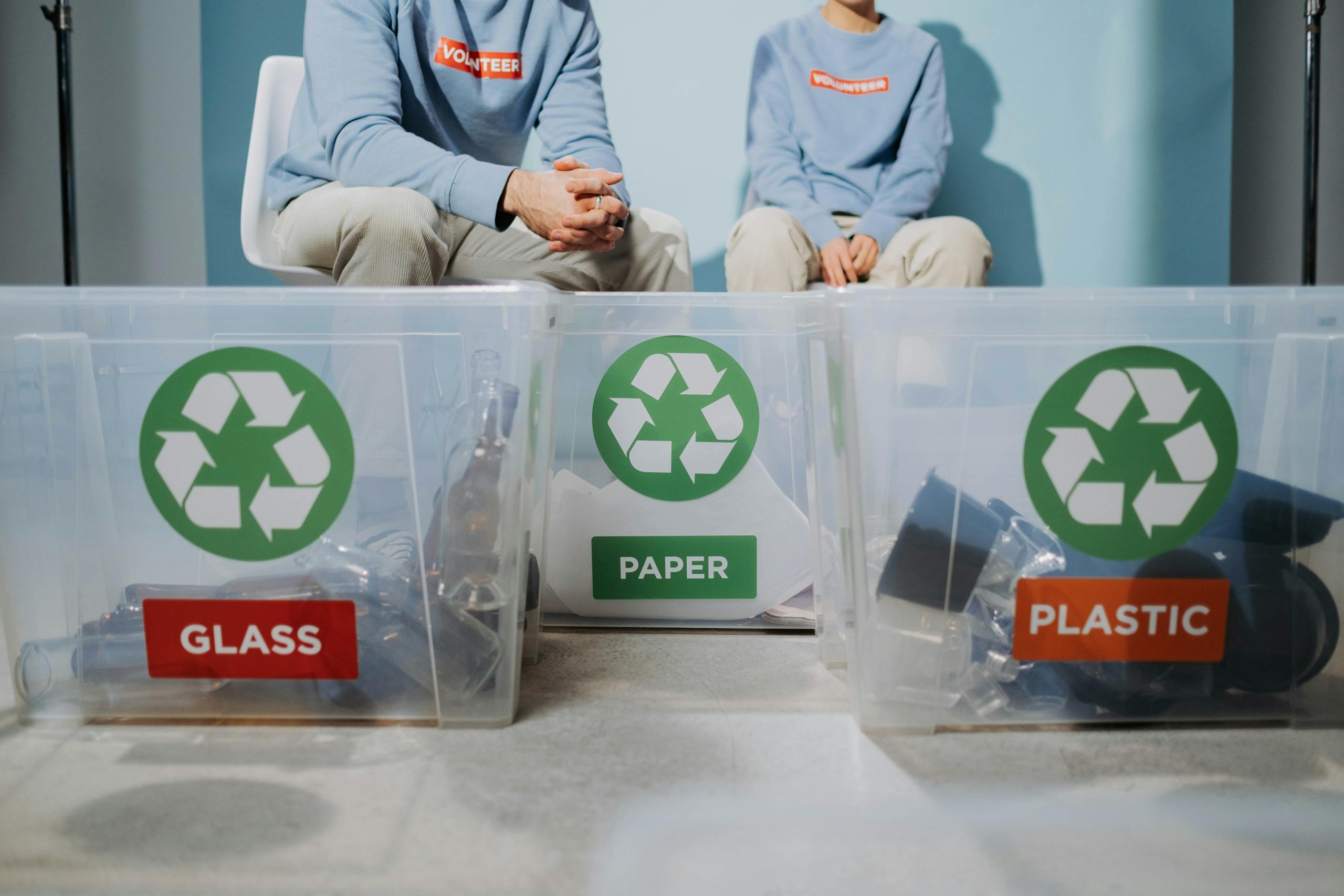 recyclables into glass, paper, and plastic bins to promote eco-friendly practices.