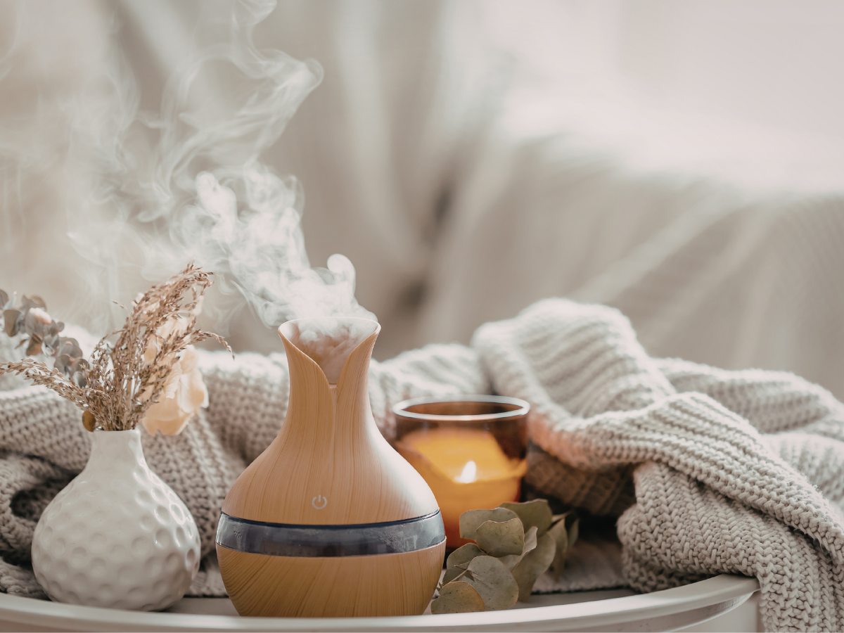 warm lamp light and candles creating a cosy holiday atmosphere at home — how to make your home feel like a holiday every day