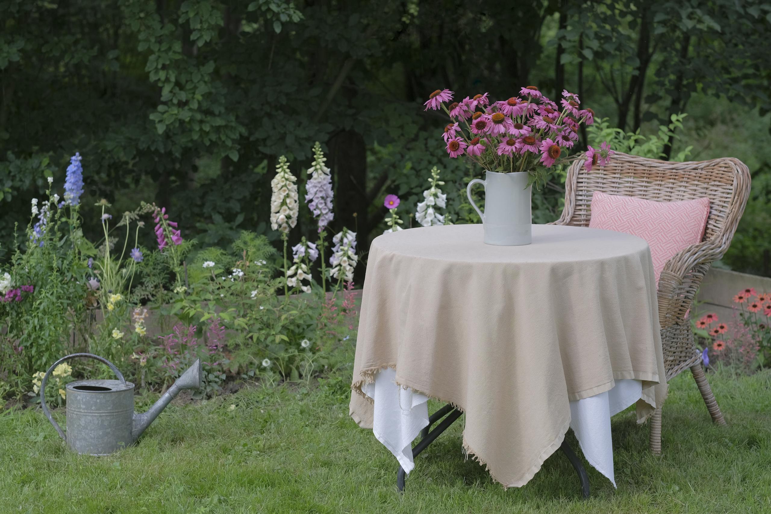 Elegant garden scene with pink coneflowers on a table, perfect for summer outdoor vibes.