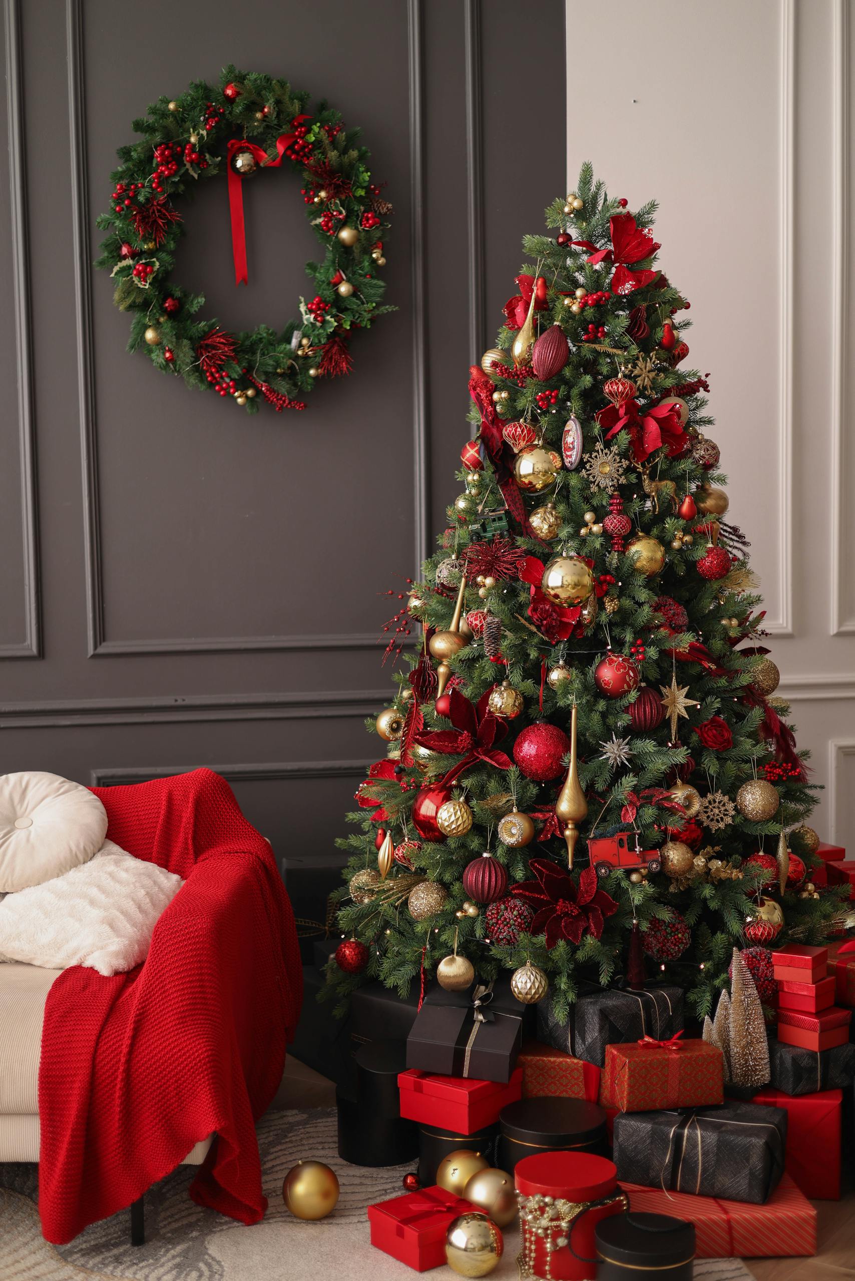 Elegant Christmas scene with a decorated tree, gifts, and wreath.