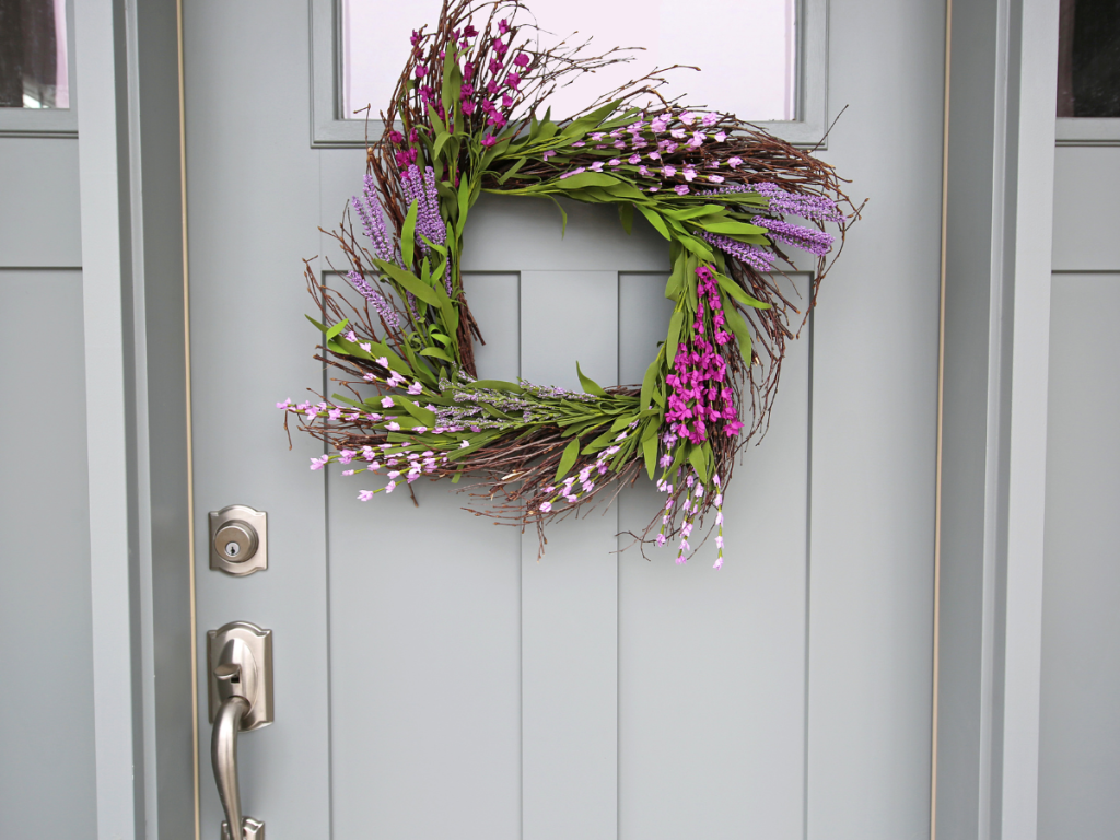 summer front door wreath on a lilac door