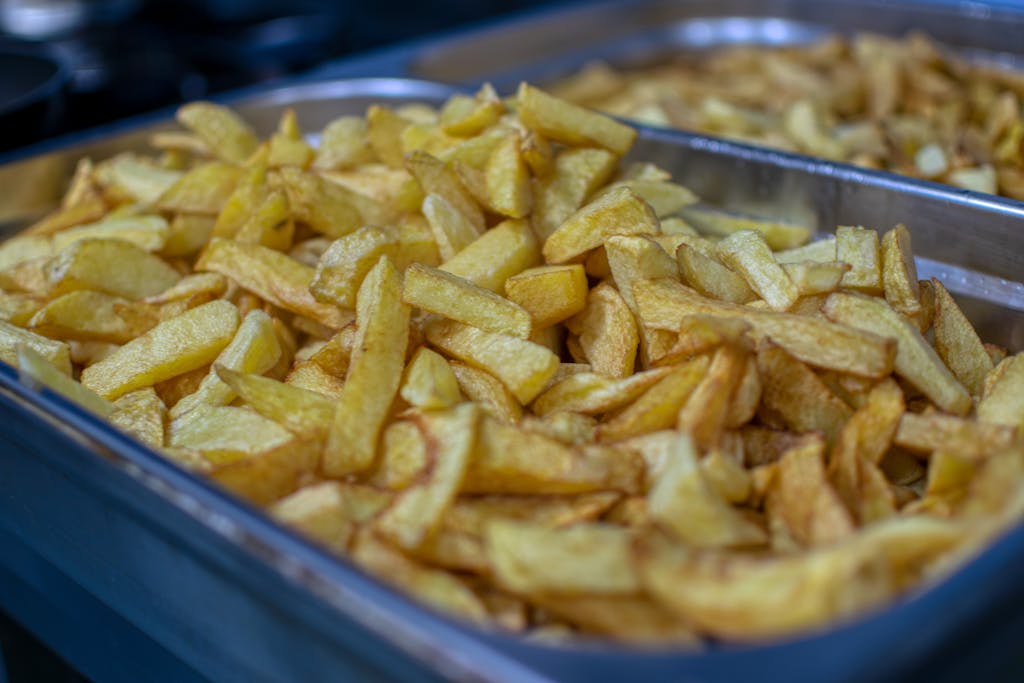 chips- British food words that mean different things in America chips crisps biscuits pudding UK vs US English