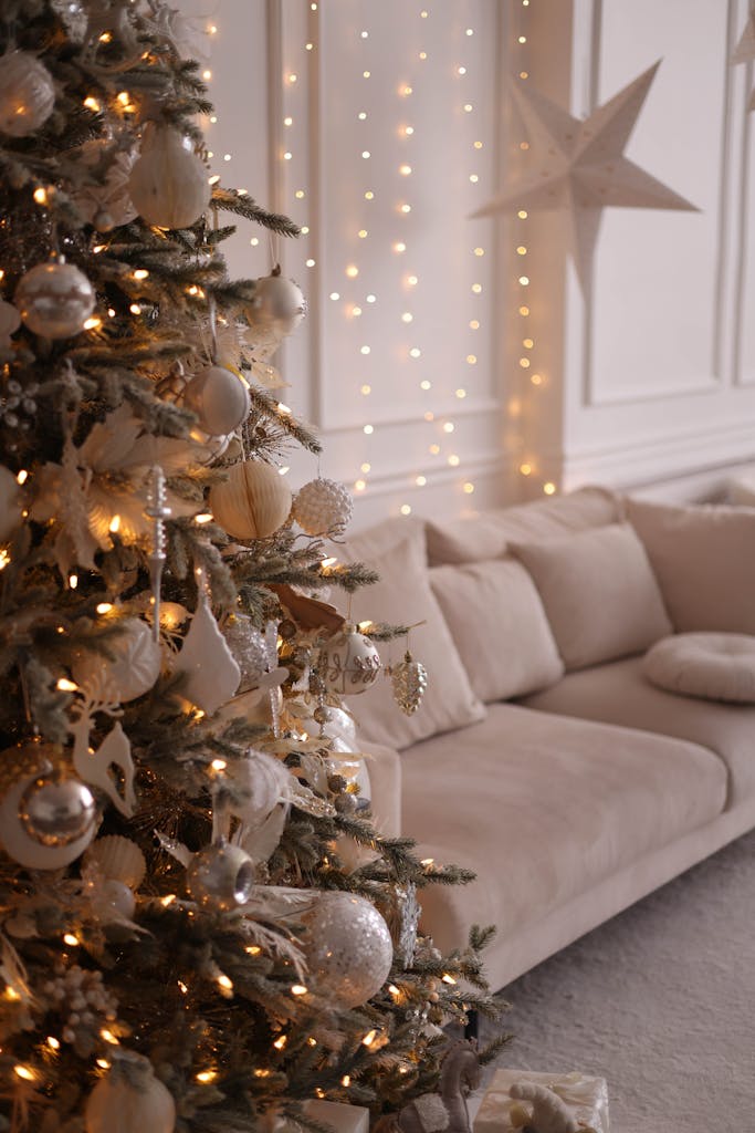 Cozy living room with a beautifully decorated Christmas tree and warm fairy lights.