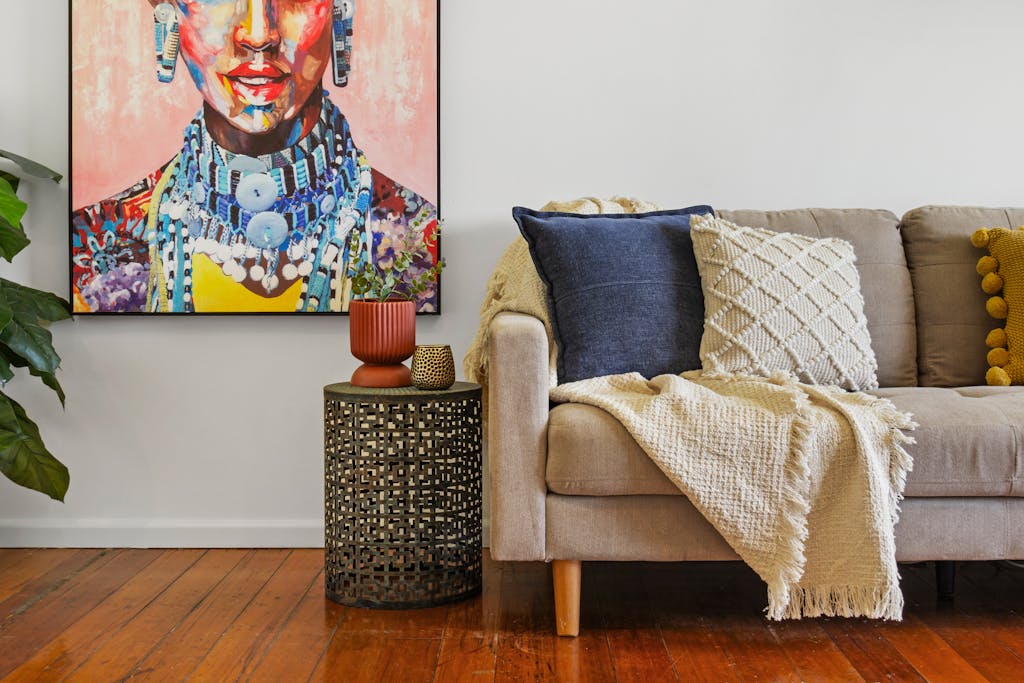 Cozy living room with vibrant artwork and stylish decor.