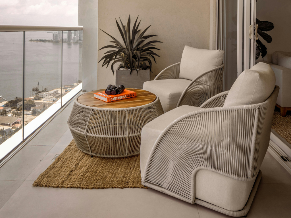 outdoor rug with plants and bistro chairs staycation feel
