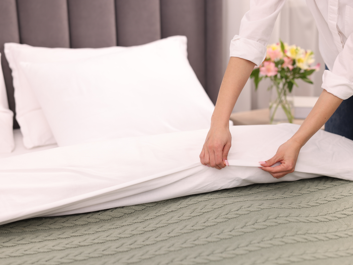white Egyptian cotton pillowcases and duvet cover on a neatly made bed home  staycation retreat