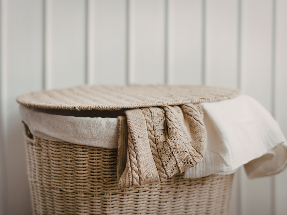 Lovely wicker laundry basket with linen linning and lid perfect for hiding bedroom mess.
