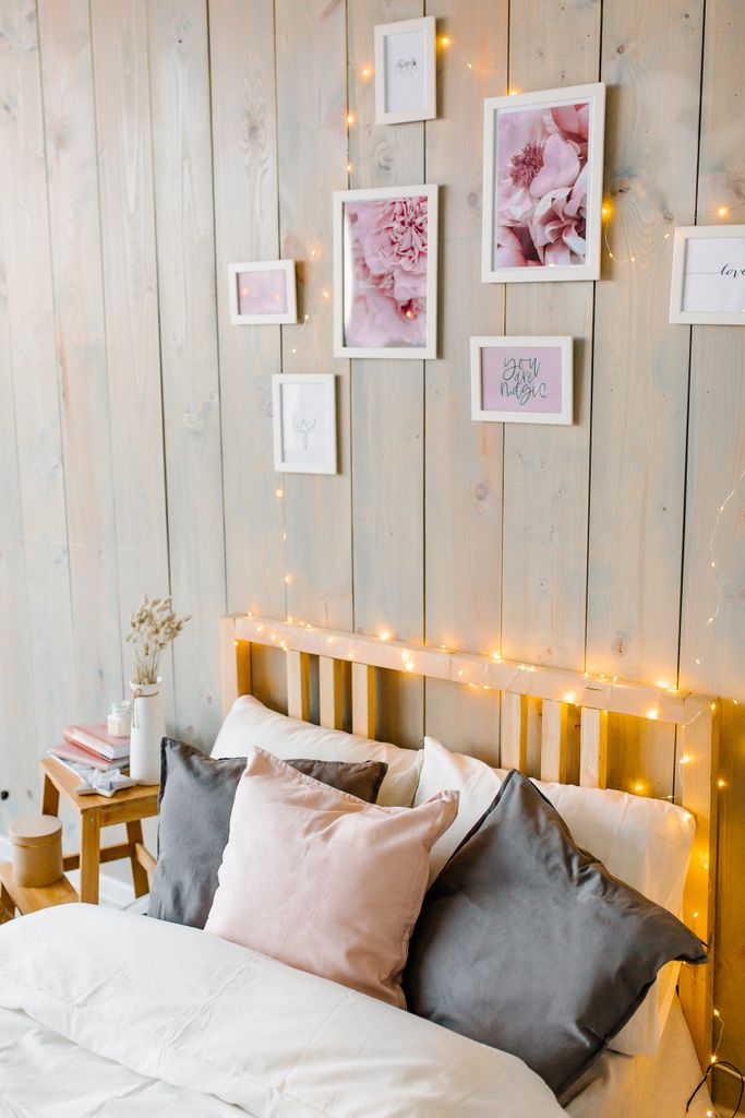 fairy lights on a wooden bed headboard for a glow up summer staycation
