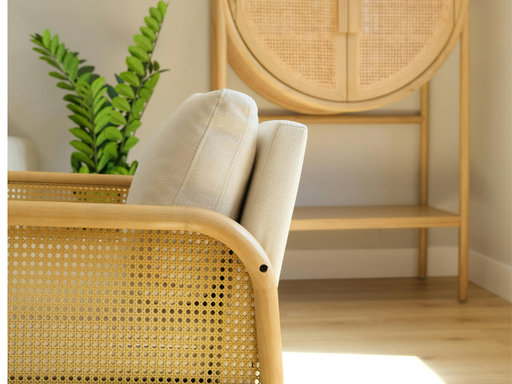 A rattan chair in a minimalist living room