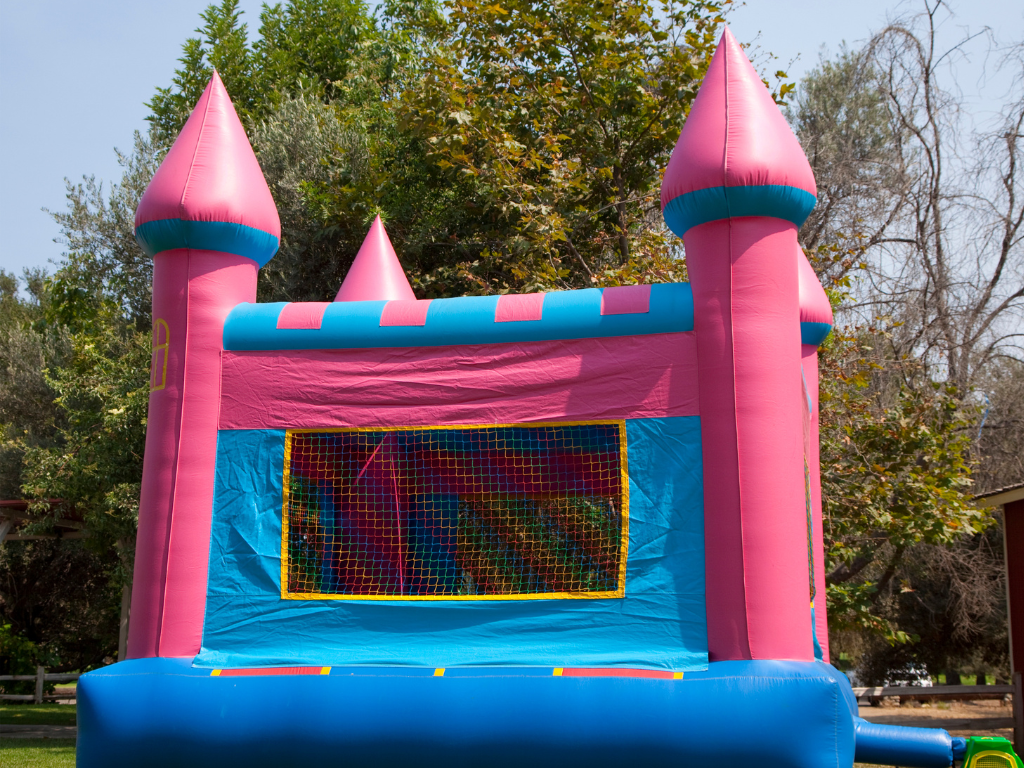 A blue and pink Bouncy castle