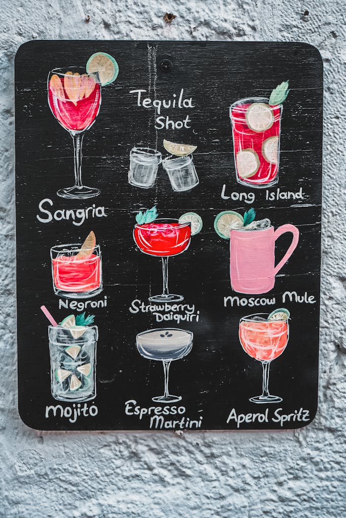 Chalkboard menu featuring various popular cocktails with artistic illustrations.