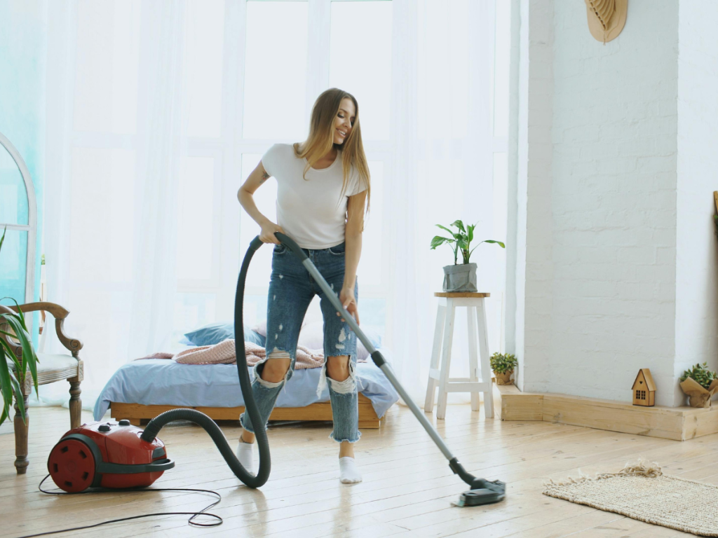 woman deep cleaning one space in her home for a summer staycation