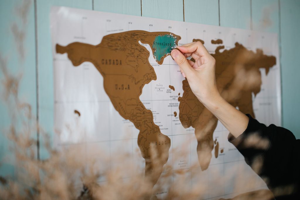 World map scratch poster used for staycation planning
