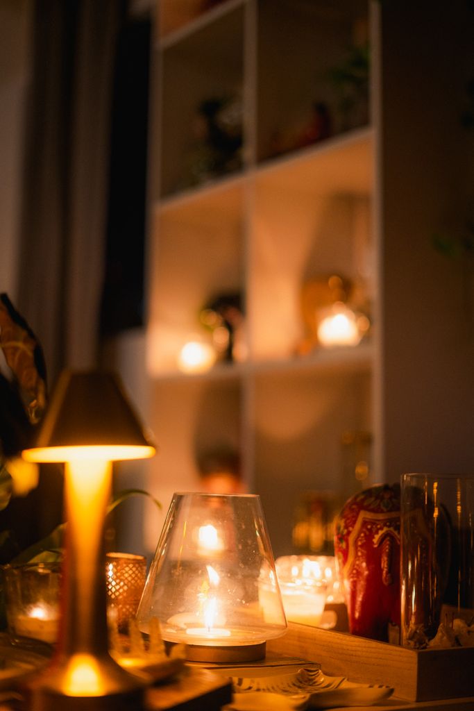 Cozy indoor scene featuring candles and soft lighting, perfect for a relaxing ambiance.