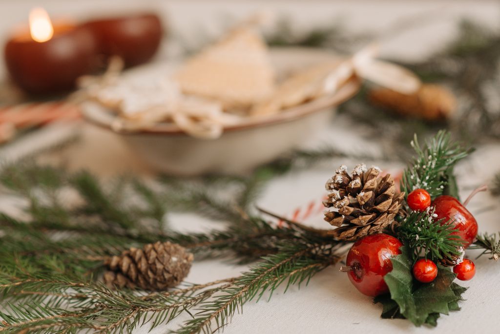 Elegant arrangement of pine cones and holly berries, perfect for Christmas decor inspiration.