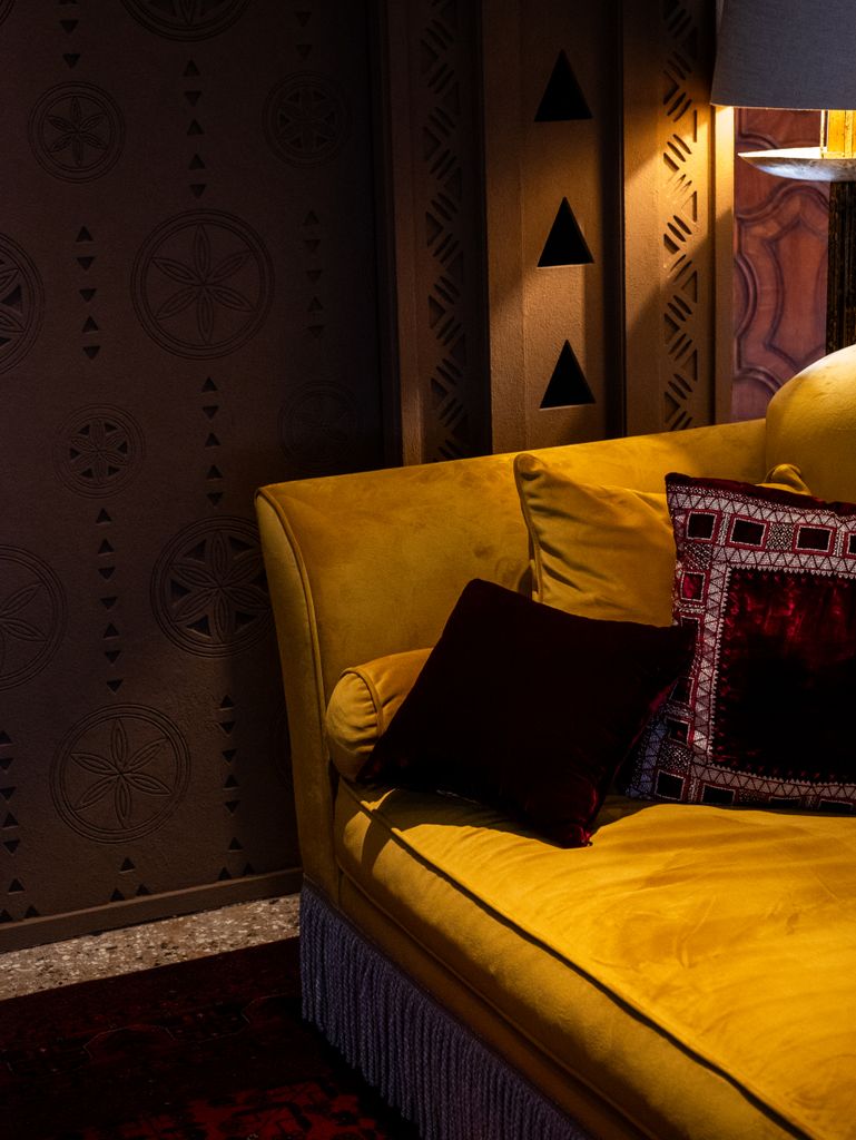 Burgundy velvet cushion covers styled on a living room sofa